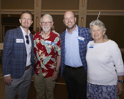 4 people smiling