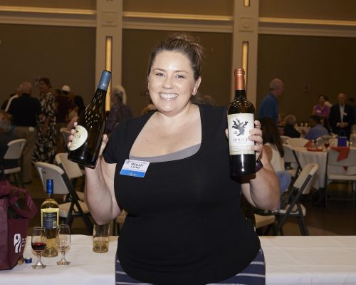 woman holding up bottles