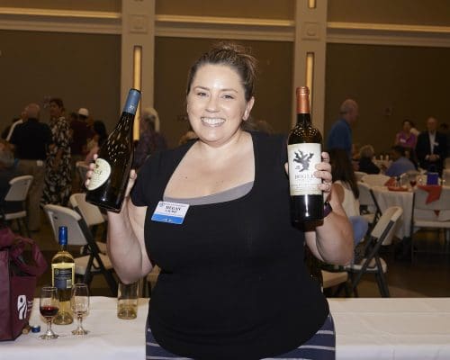 woman holding up bottles