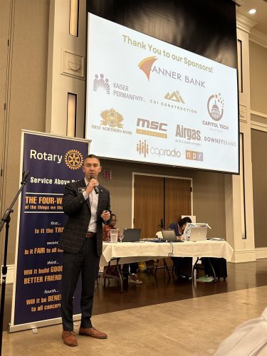 man speaking into microphone