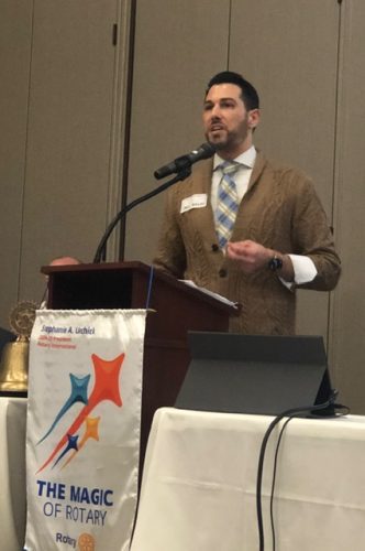 man speaking into microphone