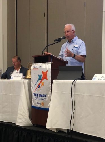 man speaking into microphone