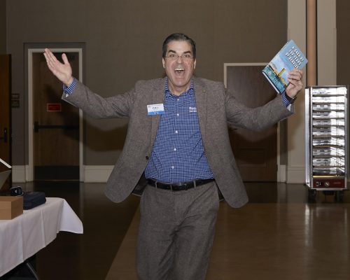picture of a person celebrating while holding a paper