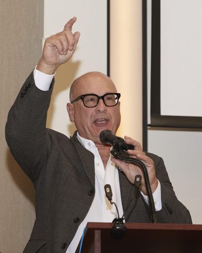 person speaking into microphone 