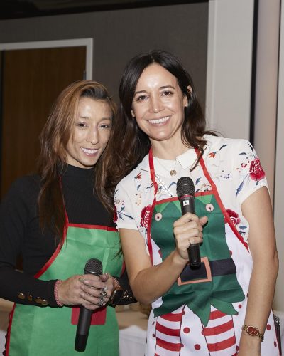 two people holding bottles