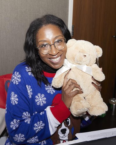 person holding a stuffed animal