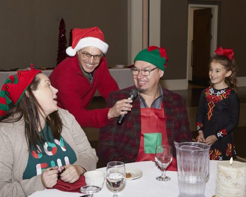 person holding microphone for someone else to speak into