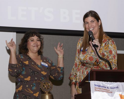 person speaking into microphone