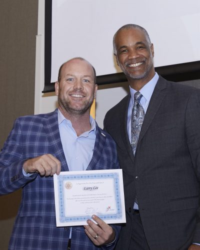 bobby holding a certificate