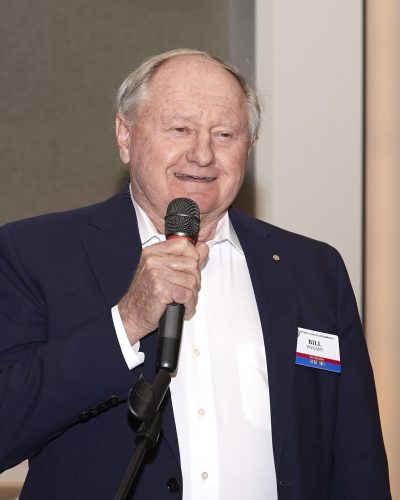 person speaking into micorphone