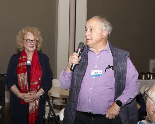 person speaking into micorphone