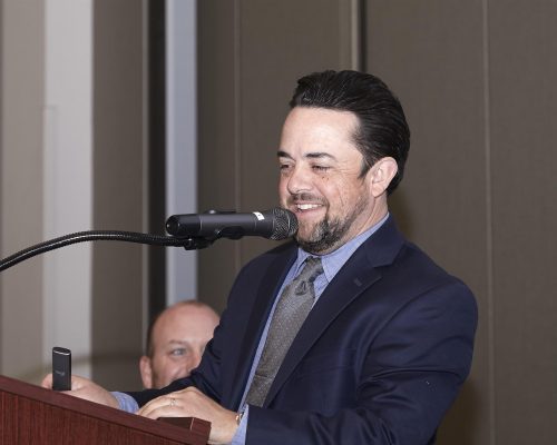 person speaking into microphone