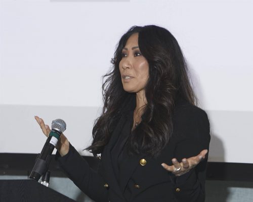 person speaking into microphone