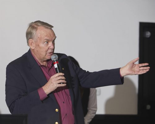 person speaking into microphone