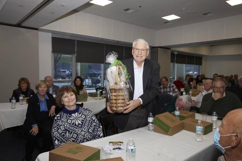 person holding a prize basket