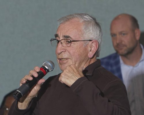 person speaking into microphone