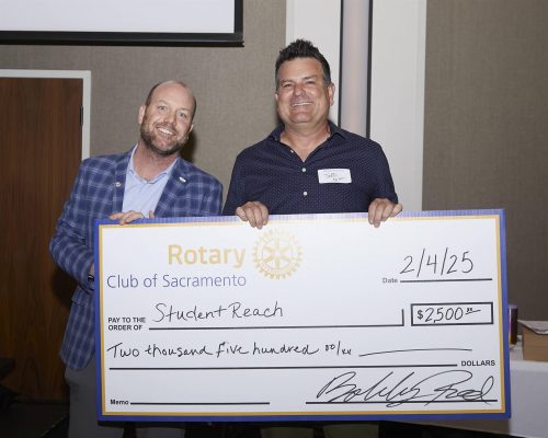 person holding big check