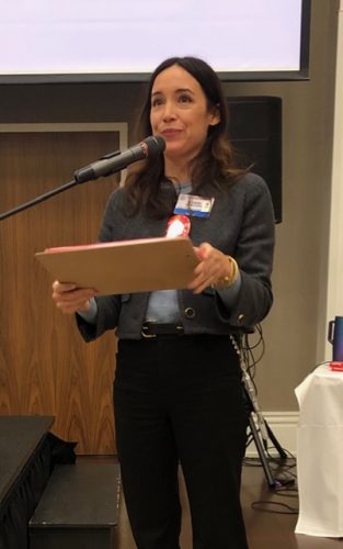 person speaking into micophone