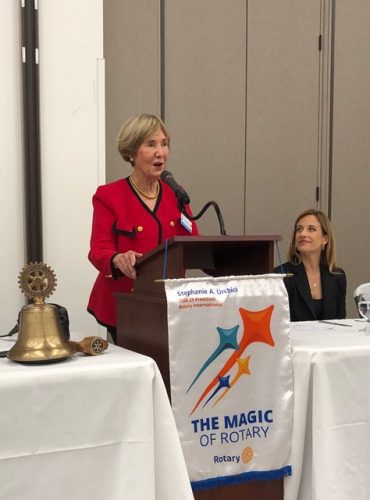 person speaking into microphone