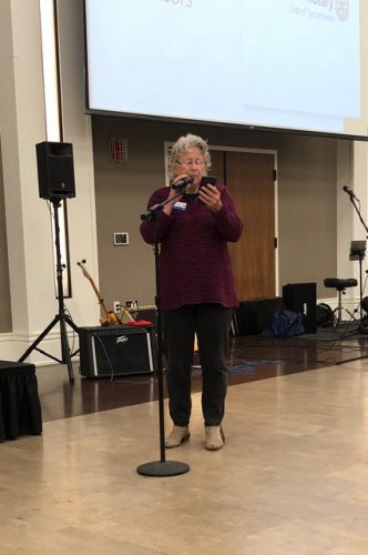 person speaking into microphone