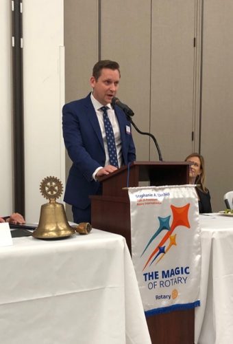 person speaking into microphone