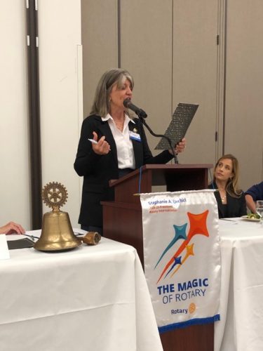 person speaking into microphone