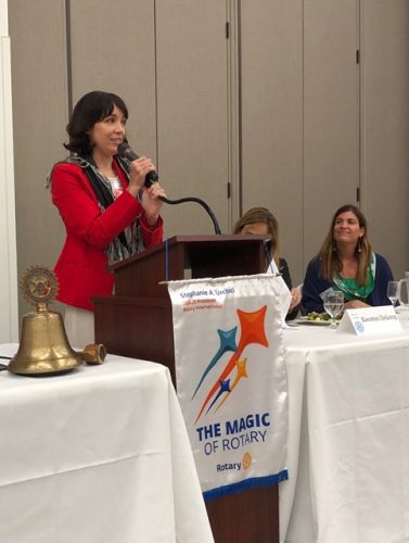 person speaking into microphone