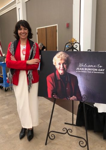 person standing next to jean runyon day poster