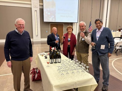 group photo by table with bottles