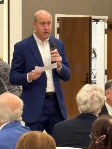 person speaking into microphone