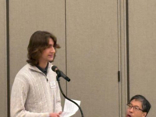 person speaking into microphone