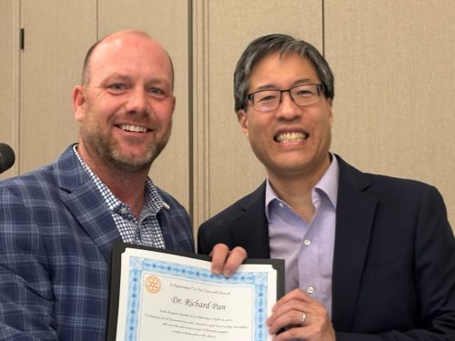 bobby holding a certificate