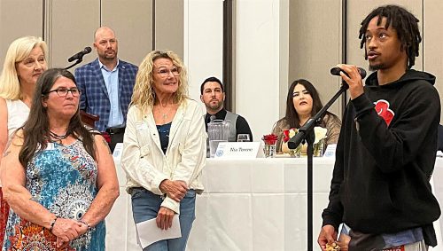 person speaking into microphone