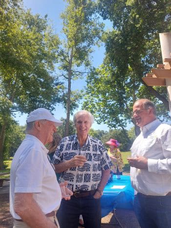Group of men socializing while having wine