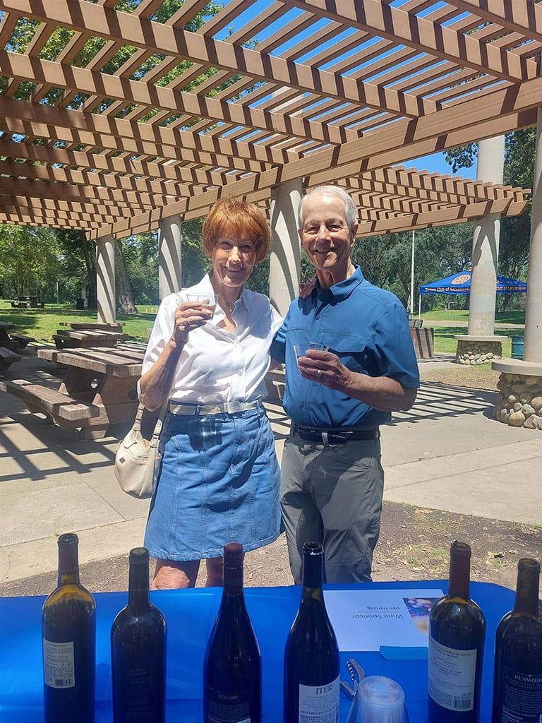 Two person having a great time tasting wine