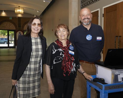 Two women and one man of Rotary Sacramento standing together for a photograph