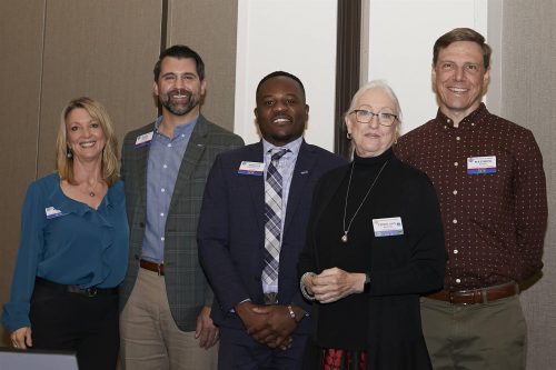 Some men and women of Rotary Sacramento standing together for a photo