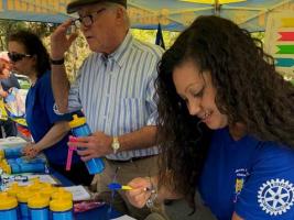 A volunteer at the Sacramento Century Bike Race reviews papers