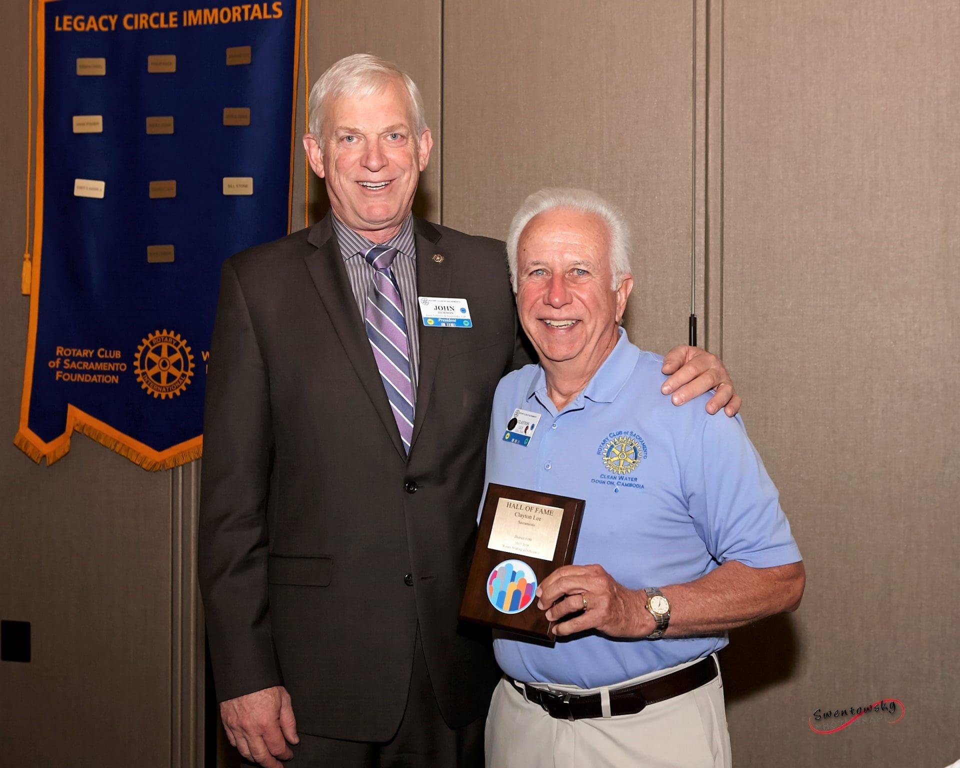 an image of John Lemmon presenting Clayton Lee with an award