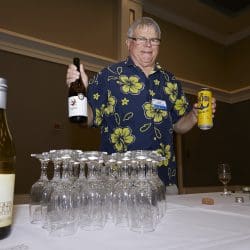 Person at table with lots of bottles