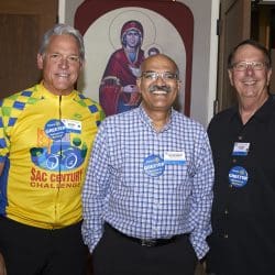 three people smiling