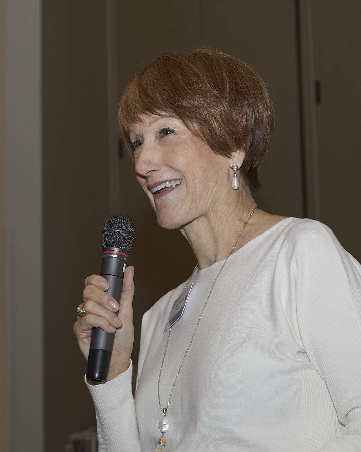 Woman speaking into microphone