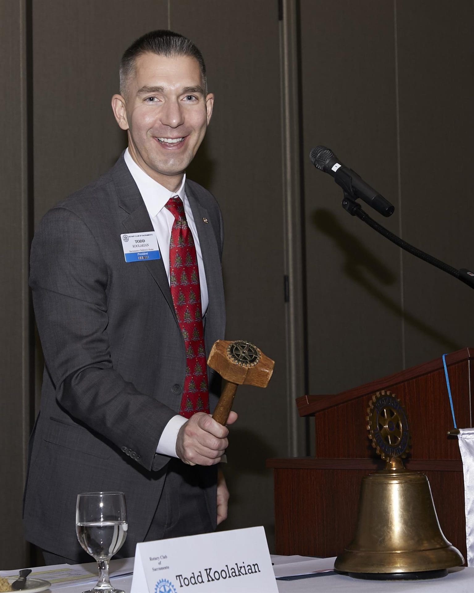 President Todd with gavel about to ring the bell