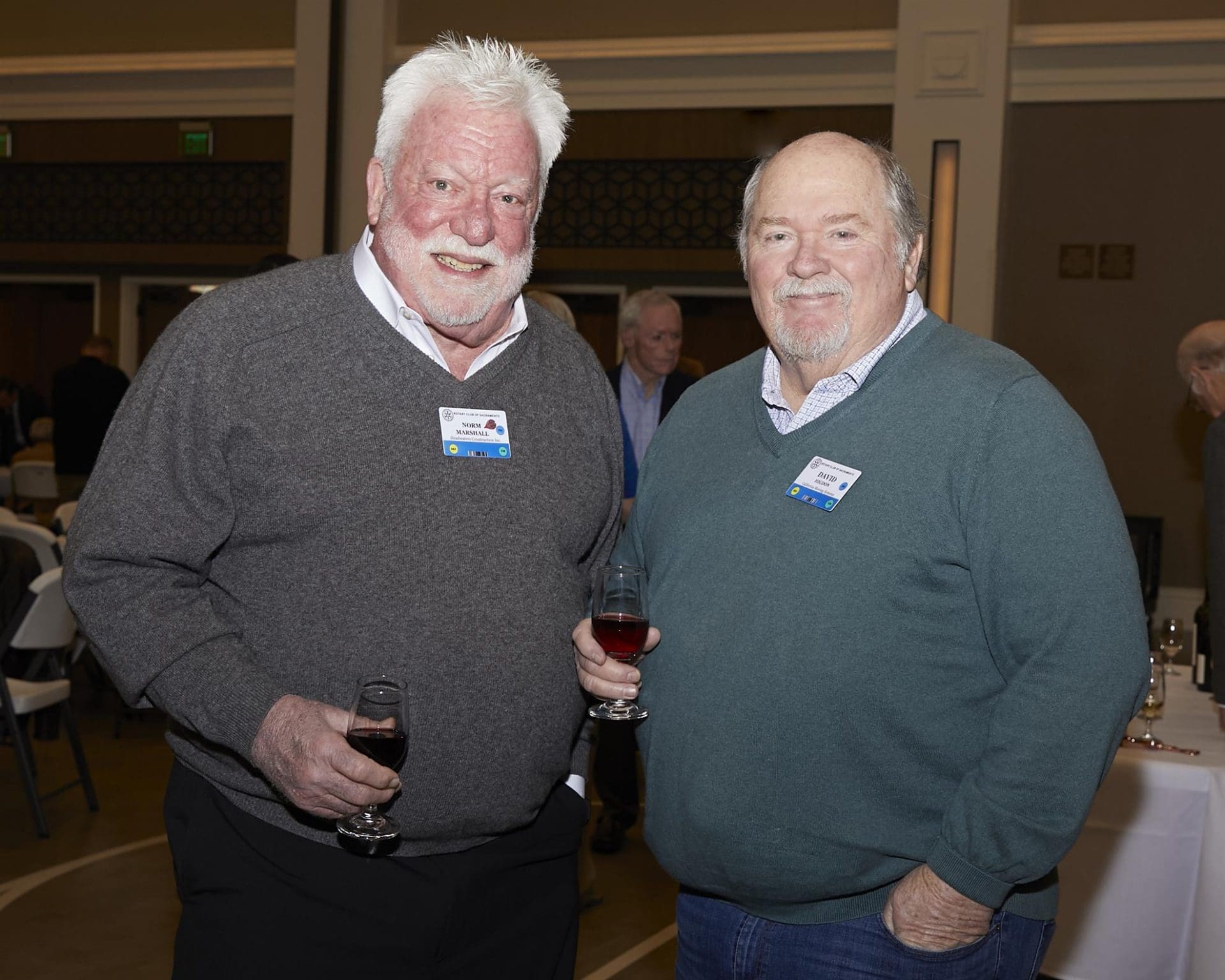 Two men posing for camera