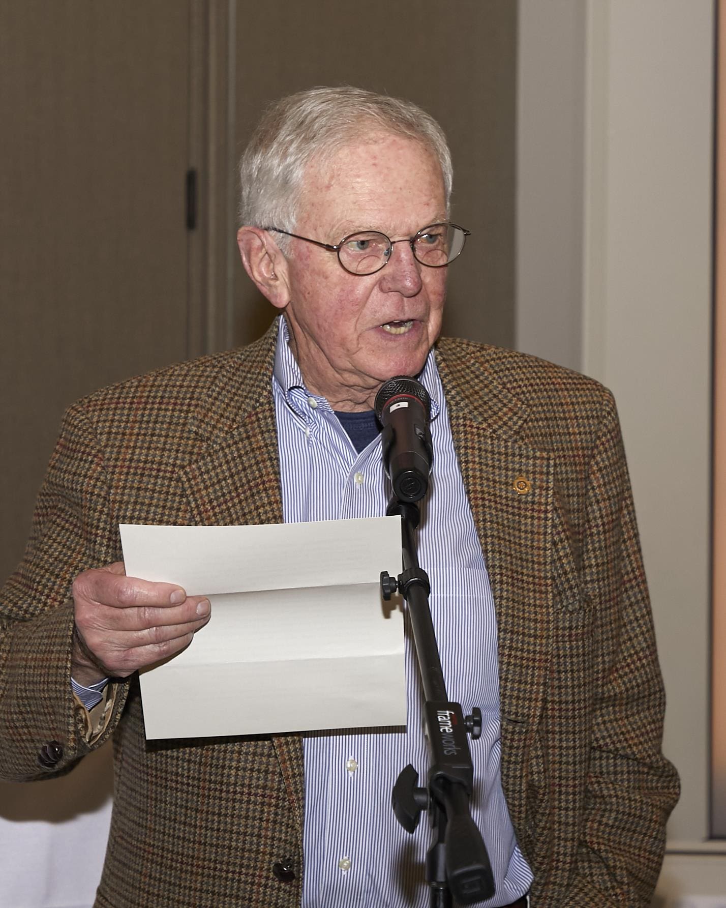Man speaking into microphone