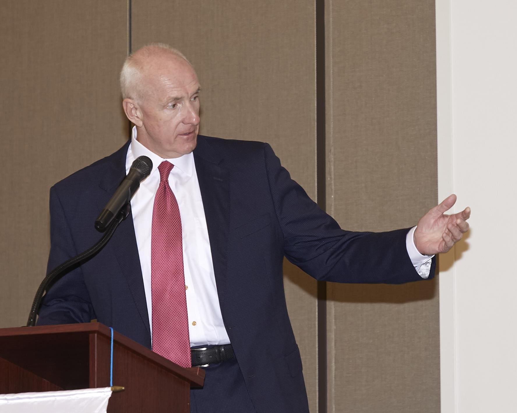 a speaker using his hands to express what he is saying