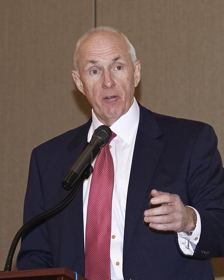 a speaker using his hands to express what he is saying