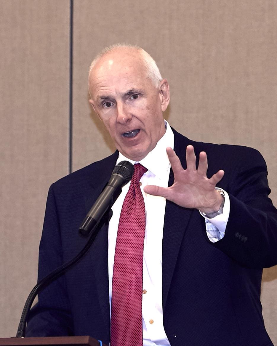 a speaker using his hands to express what he is saying