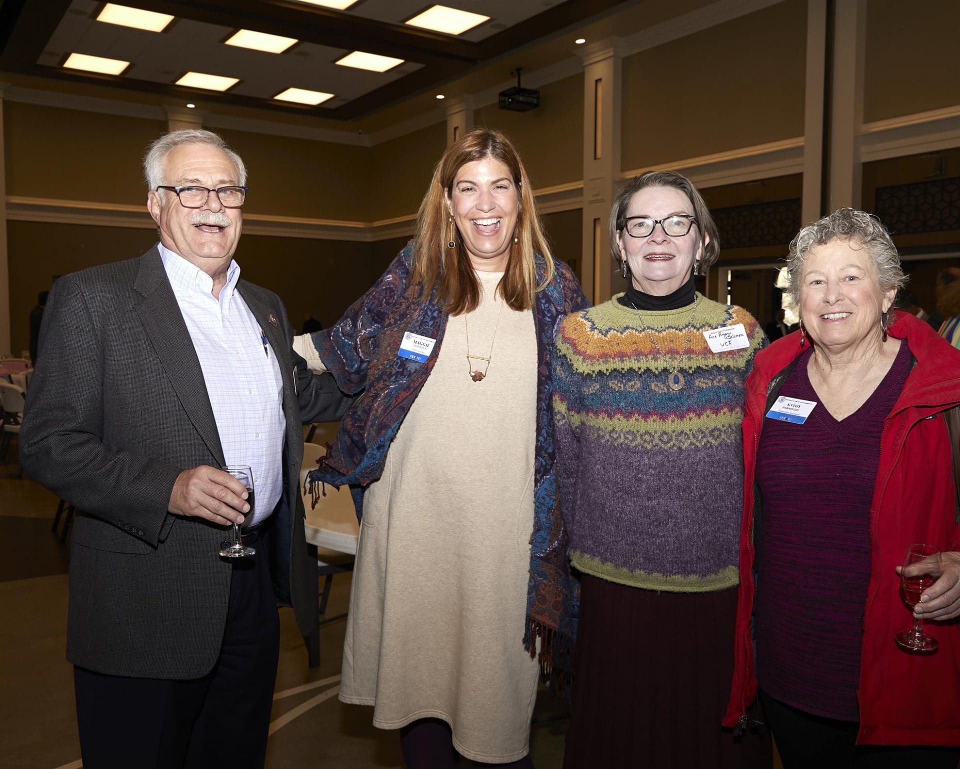 4 people smiling