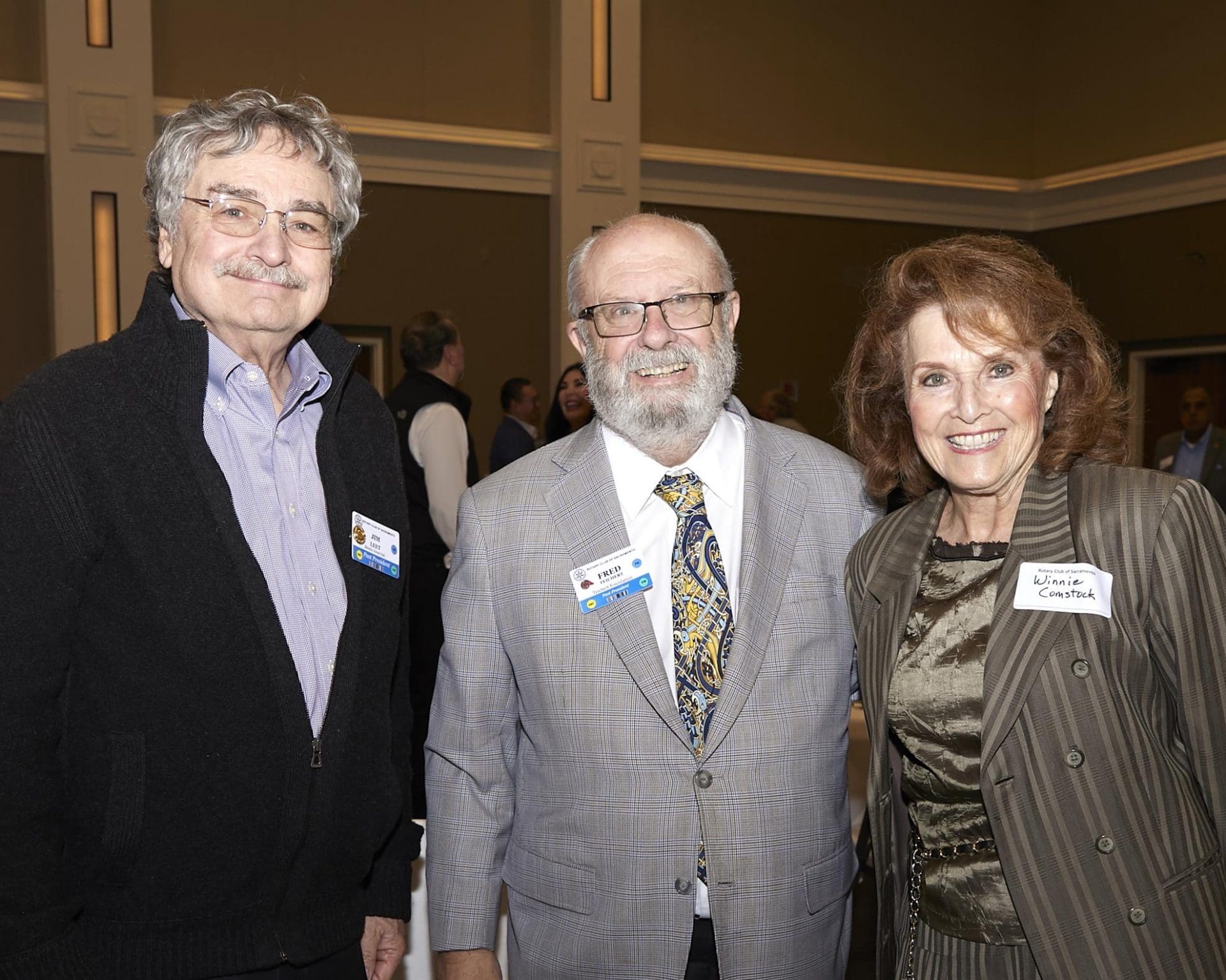 3 people smiling